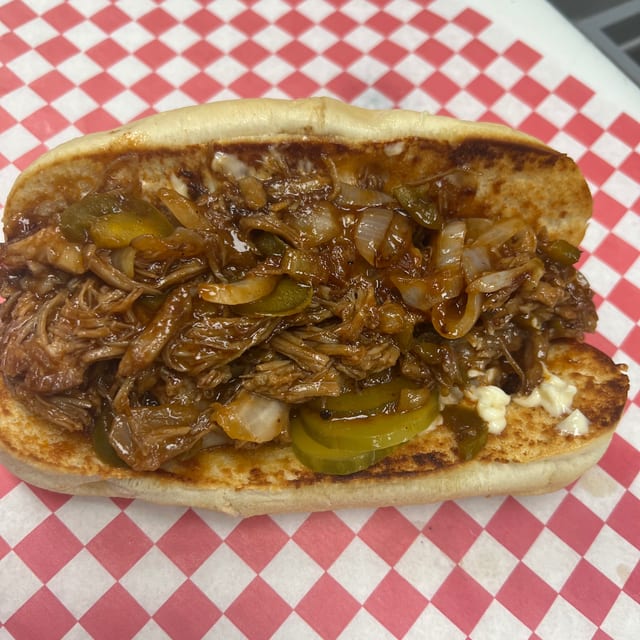 PULLED PORK SANDWICH AND FRIES.